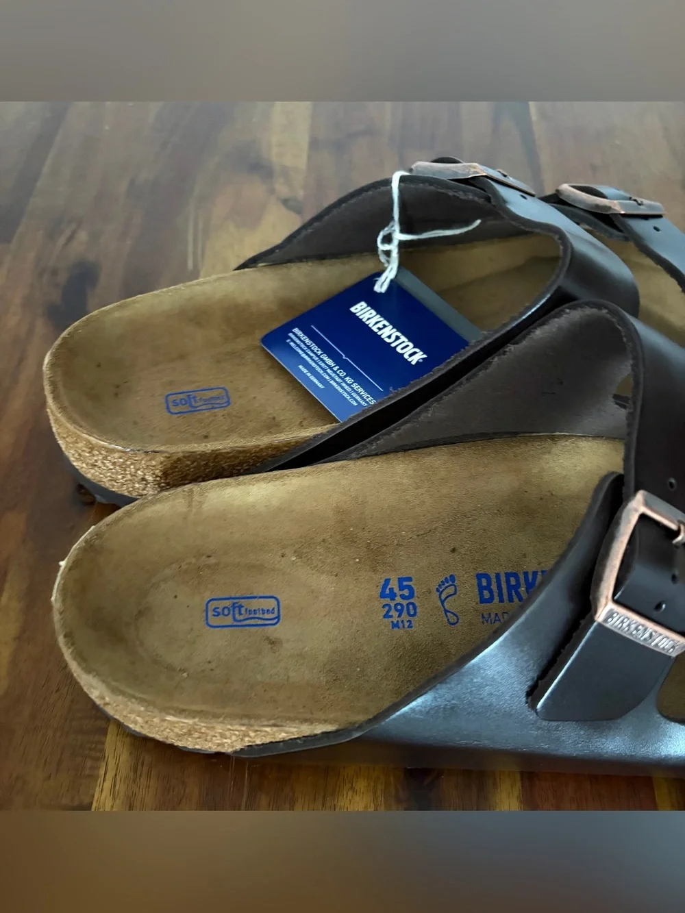 Birkenstock Men’s Arizona Two-Buckle Sandal — Dark Brown with Rose Gold Buckles.